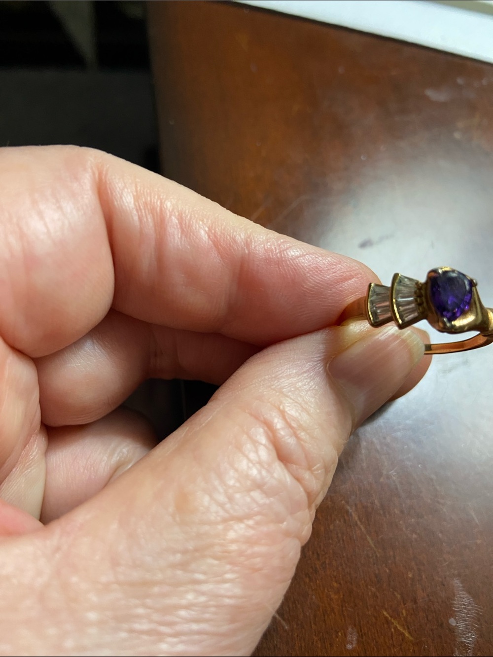 Gold Tone Ring with Purple Gemstone